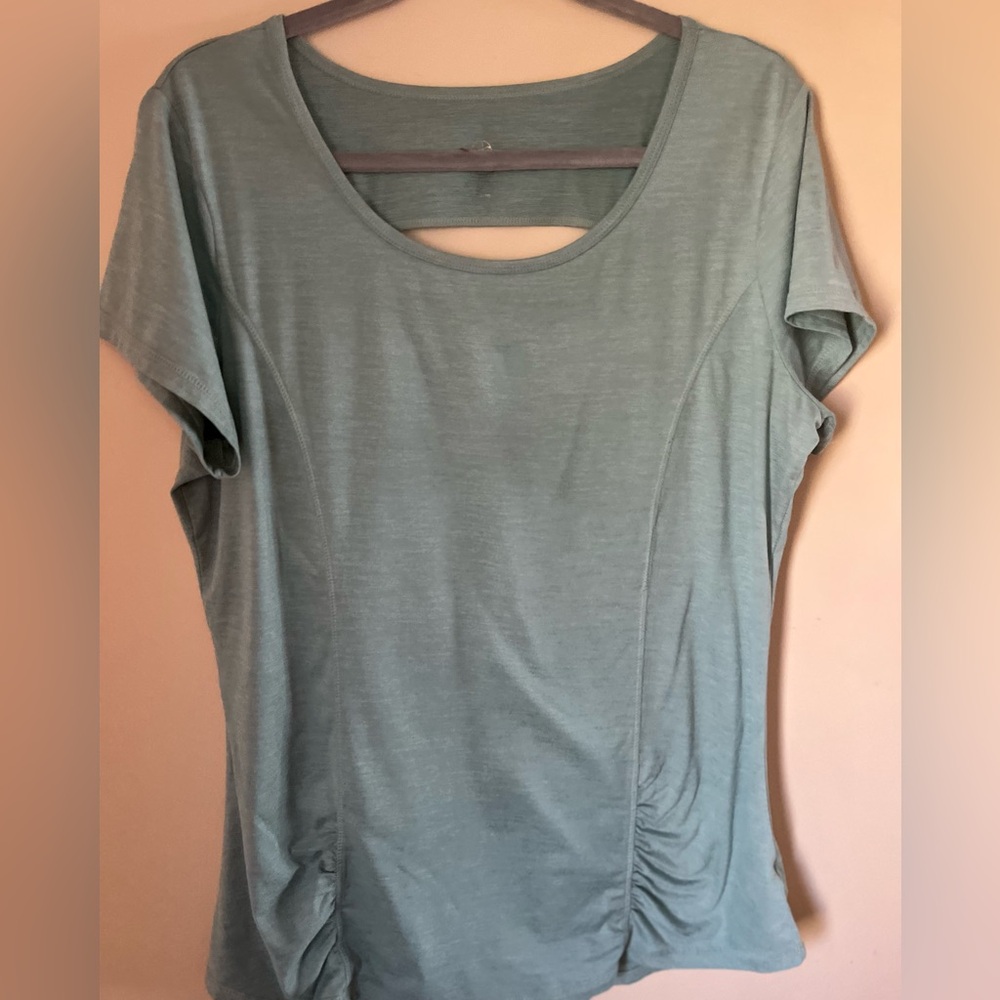Three Gaiam workout tops.